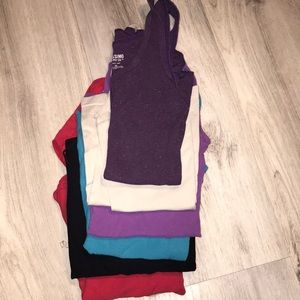 An assortment of tank tops size x-small. All used in okay to great condition.